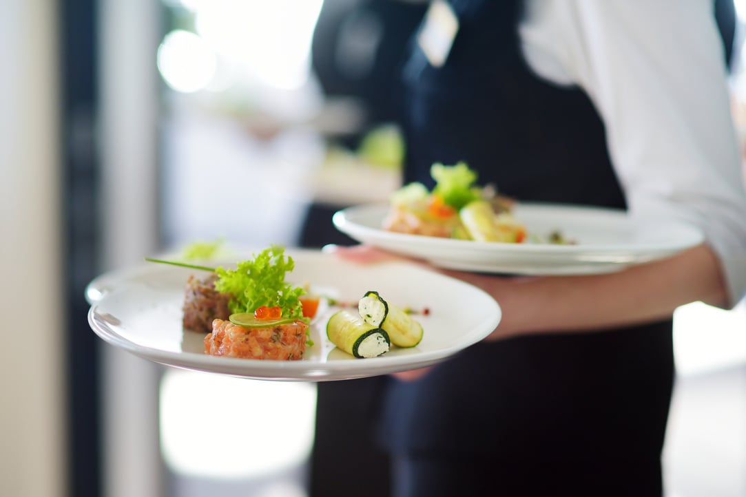 Waiter Carrying Plates  